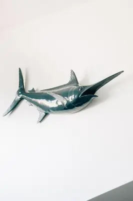 a plastic fish toy on a white wall at Adorable apartment in Nice downtown in Nice