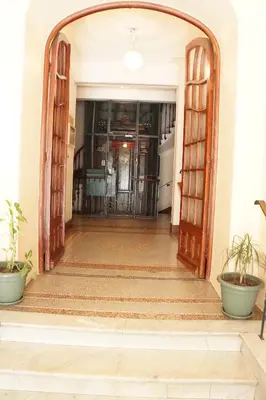 an open door into a hallway with potted plants at Adorable apartment in Nice downtown in Nice