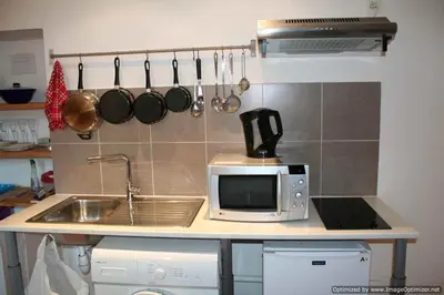 a kitchen counter with a sink and a microwave at Beach, Pure Centre, view over Opera de Nice in Nice