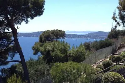 a view of a body of water with trees at Appt 5 personnes vue mer piscine Costa Plana Cap d'Ail Monaco in Cap d'Ail