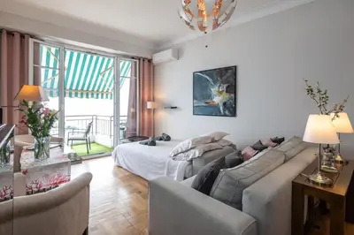 a living room with a couch and a bed at 