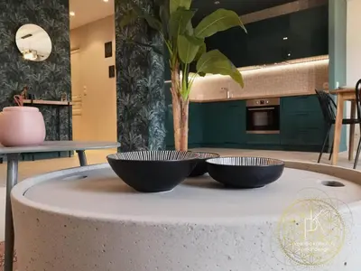 two bowls sitting on top of a round table at Appartement Carré d'Or Vue sur Mer in Nice