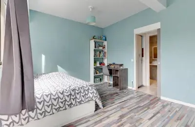 a bedroom with a large bed in front of a window at La Lanterne Plage in Nice