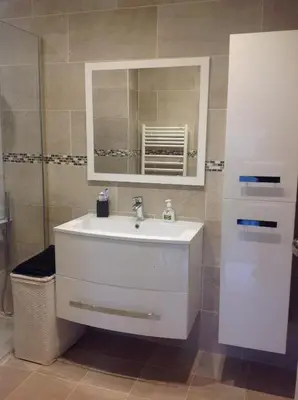 a bedroom with a bed and a large window at La Lanterne Plage in Nice