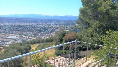 a kitchen with a glass table and chairs and a kitchen with at Villa Mt Fleuri in Nice
