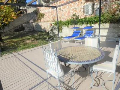 a house on a hill with a stone wall at Villa Mt Fleuri in Nice