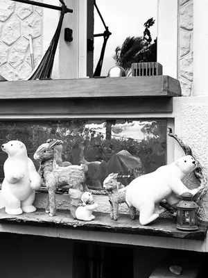 a shelf with figurines of dogs and polar bears at O Phare du Cros in Cagnes-sur-Mer