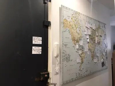 a door with a map of the world on it at Nissa la Bella in Nice
