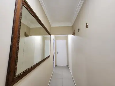 a hallway with a mirror on the wall at Promenade Appartements les Lions in Nice