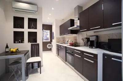 a dining room with a table and a chair at Apartment with parking in Nice near the harbor in Nice