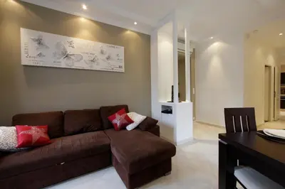 a living room with a couch and a table at Apartment with parking in Nice near the harbor in Nice