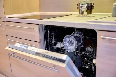 a dishwasher with dishes in it in a kitchen at Boutique apartment LA LAVANDE free parking CENTER Nice in Nice