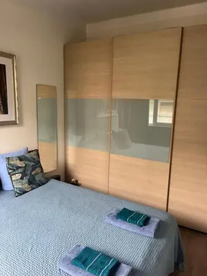 a bedroom with a bed with two towels on it at Boutique apartment LA LAVANDE free parking CENTER Nice in Nice