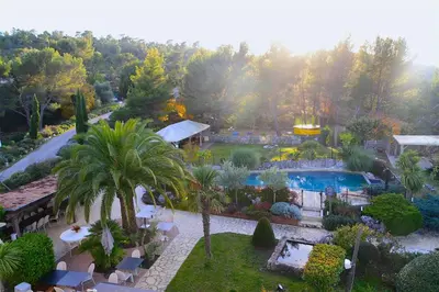 an aerial view of a garden with a swimming pool at Hôtel Eze Hermitage in Èze