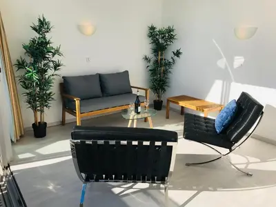 a living room with a couch and a table at COSTA PLANA COLLECTION - Cap d'Ail - Monaco in Cap d'Ail