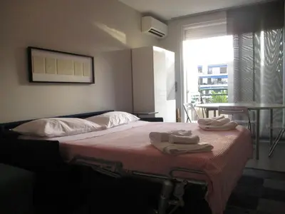 a bedroom with a bed with two towels on it at Appartement Cattleya - rue halevy in Nice