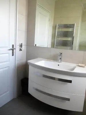 a bathroom with a white sink and a mirror at Appartement Cattleya - rue halevy in Nice