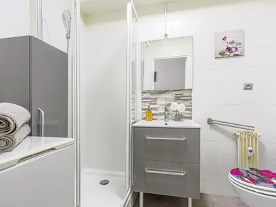 a bathroom with a shower and a sink and a toilet at Studio Ciel de Fabron by Interhome in Nice