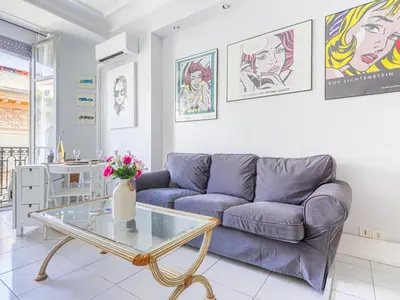 a living room with a couch and a glass table at Apartment Le Concordia by Interhome in Nice