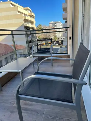 a pair of chairs sitting on top of a balcony at Studio With Swimming Pool 80 meters near the beach in Nice