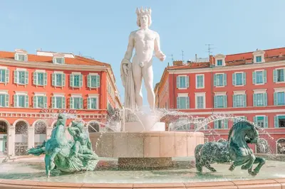 a statue of a man and two horses in a fountain at Centre, deux pièces, calme, terrasse plein sud in Nice
