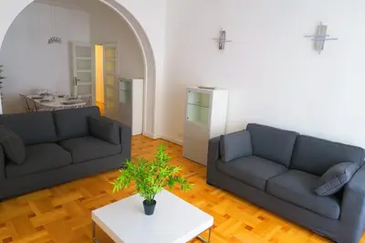 a living room with two couches and a table at Carré d’Or Appt 4 Pièces moderne et spacieux in Nice
