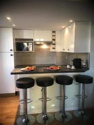 a kitchen with two plates of food on a counter at Charme Méditerranéen Votre pied à terre au Cœur du Port de Nice in Nice