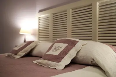 two beds with pillows on them in a bedroom at Hotel Victor Hugo Nice in Nice