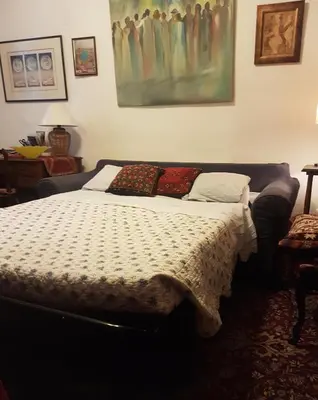a bedroom with a bed and a painting on the wall at Family Apartment 2BR Old Town near Beach AC in Nice