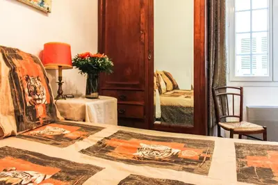 a bedroom with a bed and a mirror at Family Apartment 2BR Old Town near Beach AC in Nice