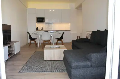 a living room with a couch and a table at Nice Plein Centre, Calme et Proche de la mer in Nice