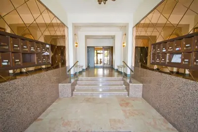 a hallway with stairs and lockers in a building at PROMENADE HOLIDAY - VERSAILLES PROMENADE in Nice