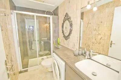 a bathroom with a sink and a toilet and a shower at PROMENADE HOLIDAY - PALATIN & SEA in Nice