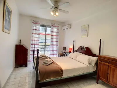 a bedroom with a large bed and a window at Nestor&Jeeves - DEBUSSY TERRASSE - Central - By shopping area in Nice