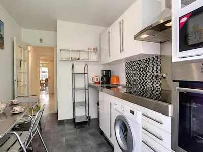 a kitchen with a washer and dryer at Nestor&Jeeves - DEBUSSY TERRASSE - Central - By shopping area in Nice