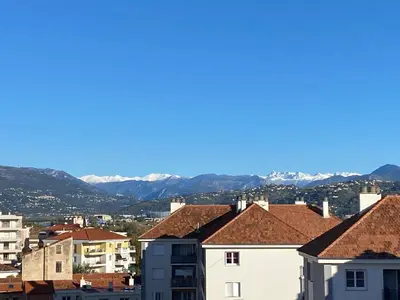 a view of the mountains from the roofs of buildings at Best Western Hôtel Journel Saint-Laurent-du-Var Aéroport in Saint-Laurent-du-Var
