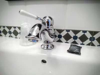 a bathroom sink with a chrome faucet on it at Best Western Hôtel Journel Saint-Laurent-du-Var Aéroport in Saint-Laurent-du-Var