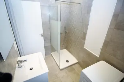 a bathroom with a shower and a toilet and a sink at Republique Garibaldi in Nice