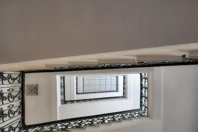 a mirror on a wall in a room at Maison Lamartine - Nice in Nice