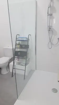 a bathroom with a toilet and a glass shower door at Nice France in Nice