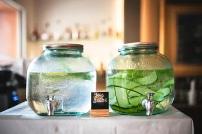 two glass jars filled with green vegetables on a table at Hotel De La Darse in Villefranche-sur-Mer