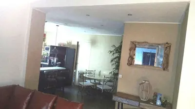 a living room with a kitchen and a dining room at Les Pieds dans l'Eau in Nice