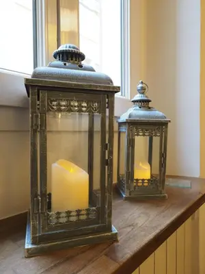 two lanterns on a table with a candle at 2 Bedroom Apartment Old Town Centre in Nice