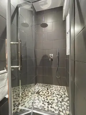 a bathroom with a shower with a glass door at 2 Bedroom Apartment Old Town Centre in Nice