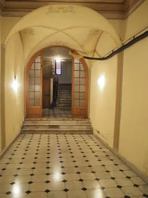 an empty hallway with a door and a tiled floor at 2 Bedroom Apartment Old Town Centre in Nice