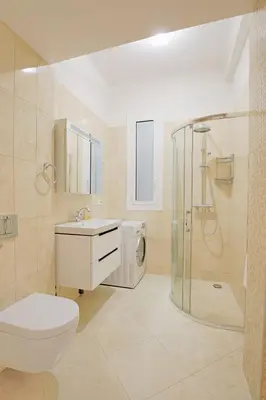 a bathroom with a toilet sink and a shower at le capitole in Nice