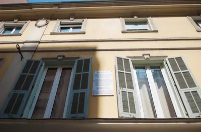 a building with shuttered windows and a sign on it at AzurAppart Elegant Studio Centre in Nice