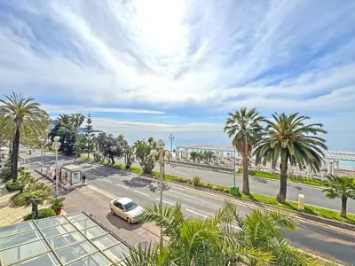 a car parked on a street with palm trees at PROMENADE HOLIDAY - ROYAL LUXEMBOURG PROMENADE in Nice