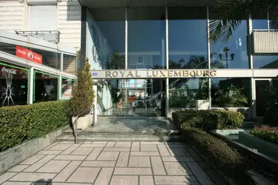 a walkway in front of a building with a sign at PROMENADE HOLIDAY - ROYAL LUXEMBOURG PROMENADE in Nice