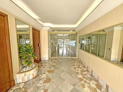 a hallway of a building with a plant at PROMENADE HOLIDAY - ROCAMARE PROMENADE in Nice
